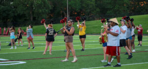 members of the marching bulldogs practice their drill
