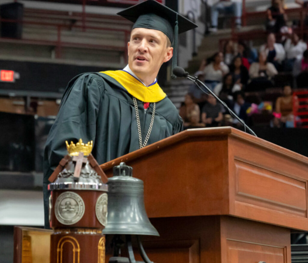President Nate Evans in cap and gown