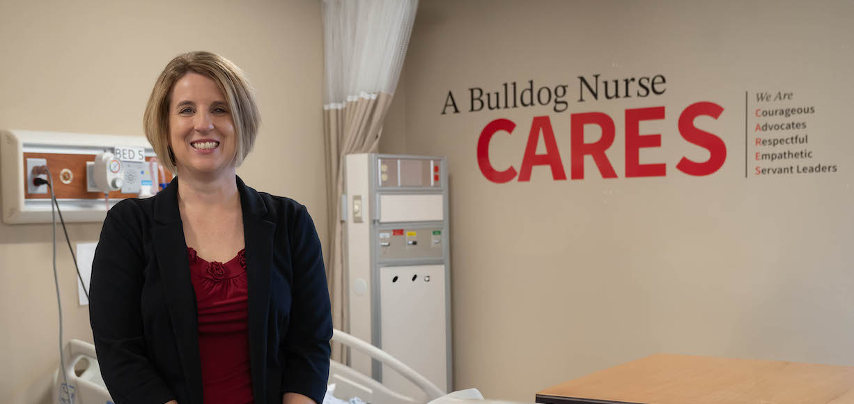Jessica Ivey Poses in the Nursing Simulation Lab