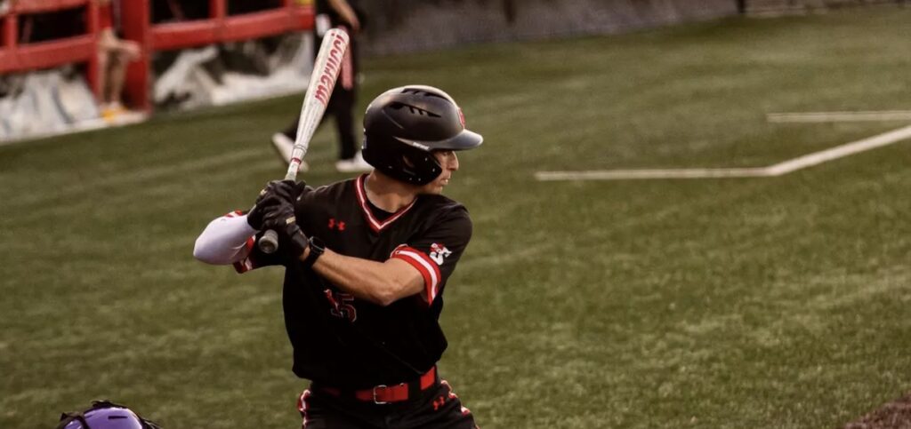 a baseball player prepares to hit the ball