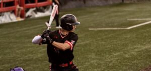 a baseball player prepares to hit the ball