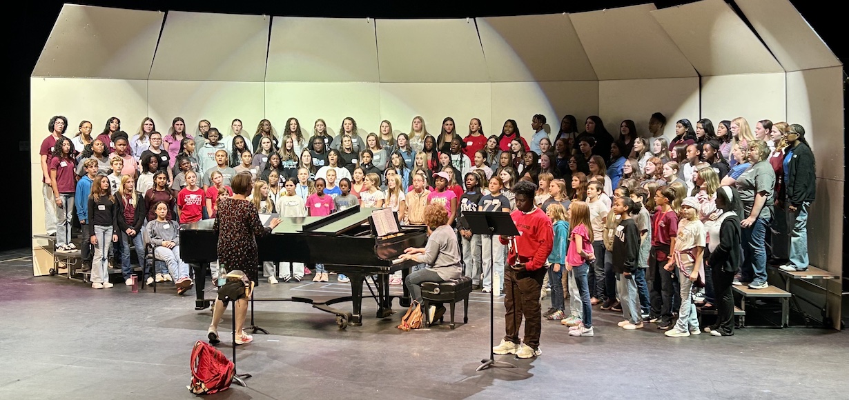 a group photo of the elementary and middle school choirs