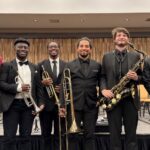 band members pose at the conference