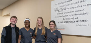 Four PA Students who were chosen for clinical rotation at MD Anderson pose for a photo