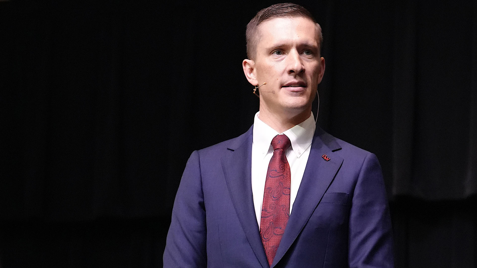 gwu president nate evans on stage