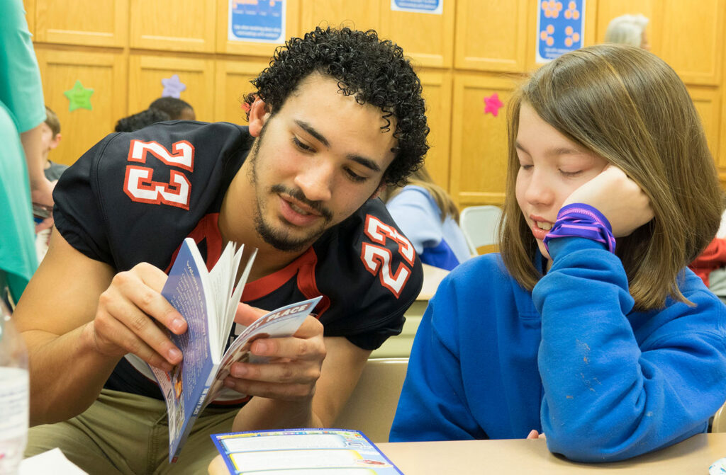gwu football breafkast and books.jpg
