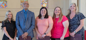 Five new members of Alpha Sigma Lambda pose at the Induction Ceremony.