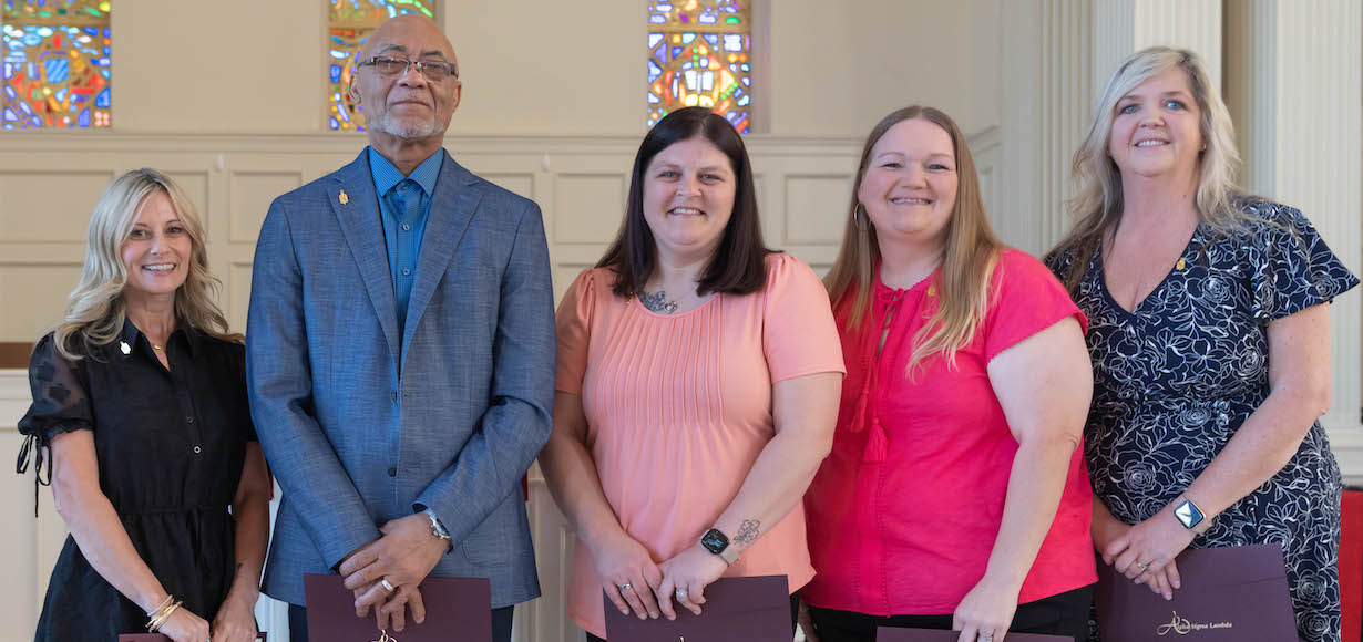 Five new members of Alpha Sigma Lambda pose at the Induction Ceremony.