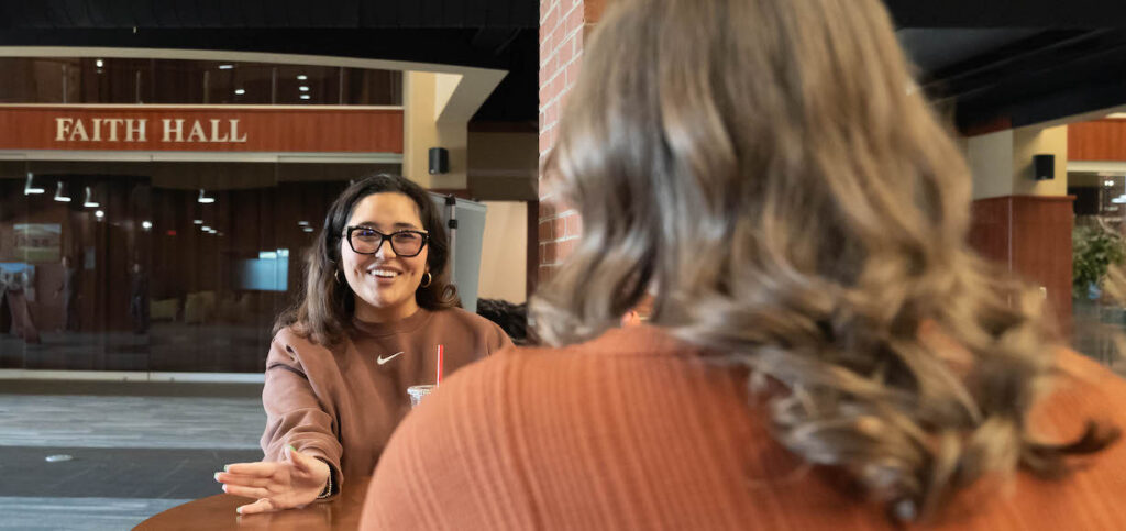 Amber Jimenez talks to her friend.