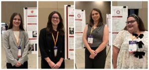 Honors students with their posters at the conference