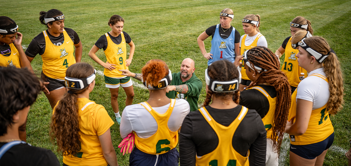 Mike Brown flag football coach on the field at team practice