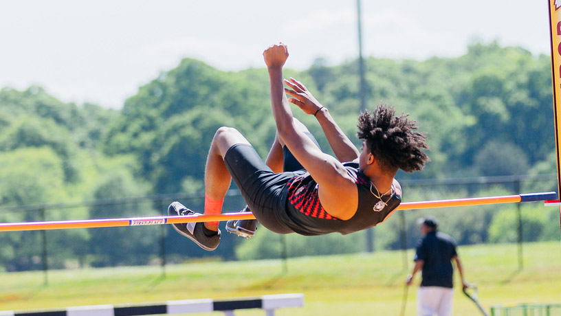 A male student on the men's track and field team.