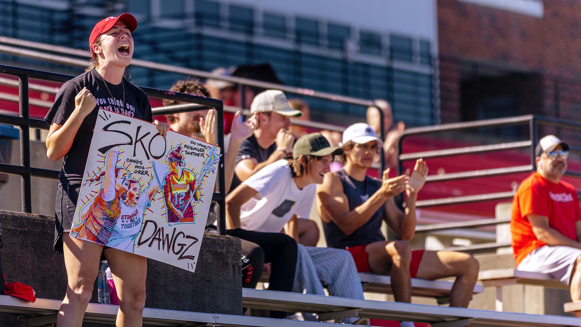 gwu student cheering lacrosse game